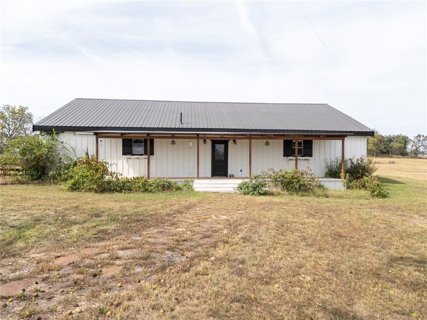 This 40.09-acre property off Vaughn Road offers a mix of wooded and pasture areas, along with two ponds. City water and electricity are available on-site, making it ready for development. Located near new residential developments, the property has quick access to the regional airport and Highway 102. It also includes a 3-bedroom, 2-bath home. Whether you're considering agricultural use, development, or personal projects, this property provides plenty of options. Please note: the red metal building on the property does not convey.