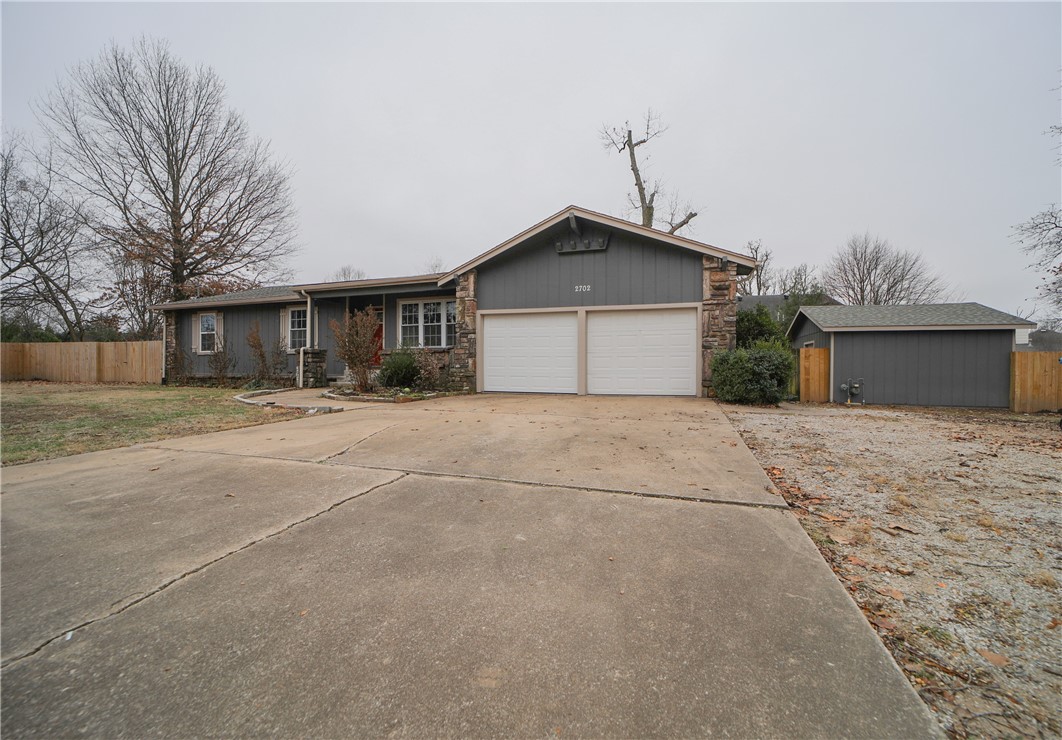 Beautiful completely updated home in fantastic Bentonville location! 3 bedrooms and 2.5 baths make this home the perfect size! Huge yard (almost 1/2 acre) with new privacy fence (2022) in backyard. Interior has all new neutral paint and LVP flooring as of 2021. Bathrooms and kitchen updated with granite and gorgeous modern neutral tiles. Large closets and plenty of storage throughout home. Close to trails, parks and everything Bentonville has to offer! Bike to the new Walmart Home Office or on the trails! Just when you thought it couldn't get any better - there is an outside workshop with electricity! Make it a she-shed, he-shed, workshop or storage!
Fireplace is woodburning and gas access is installed if you want to put in a gas insert. New roof in 2020