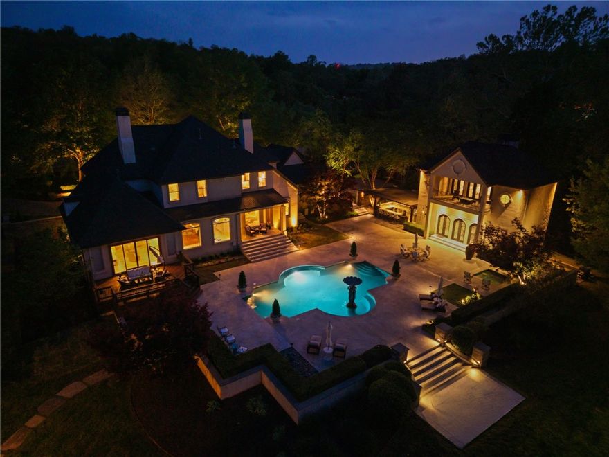 Stunning resort-style living at its finest. This exceptional estate offers the perfect blend of luxury, privacy, and thoughtful design, all set on 3.27 beautifully landscaped acres.

From the moment you arrive, you’re welcomed by a grand entrance with a striking fountain and meticulously maintained grounds that set the tone for this one-of-a-kind property. Inside, the home showcases exquisite craftsmanship with expansive marble flooring, custom lighting, and a dramatic custom iron staircase.

Designed for both everyday comfort and elevated entertaining, the home features a private office, media room, playroom, and a stunning sunken living room filled with natural light. 

Step outside to your own private retreat—complete with a resort-style pool, lush gardens, and serene creek frontage on two sides that meet at the back of the property, offering unmatched beauty and tranquility.

Entertainer’s dream, featuring a wine cellar, built-in keg tap to the movie room, and a fully equipped outdoor kitchen.