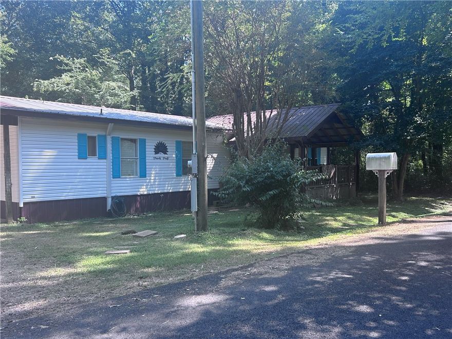 Charming 3BR/2BA Mobile Home – Perryville, AR Just a short walk to Harris Brake Lake, this spacious home features a large living room, big kitchen with pantry, oversized master suite with private bath and ample closet space, laundry room, and 2-car carport. Updates include wide plank flooring, new HVAC (2021), and metal roof (2018). Relax or entertain on the large covered front and back decks. Backyard is shaded and fully fenced and includes a 12x12 storage shed. Peaceful location, great for everyday living or a weekend retreat. Shown by appointment only.