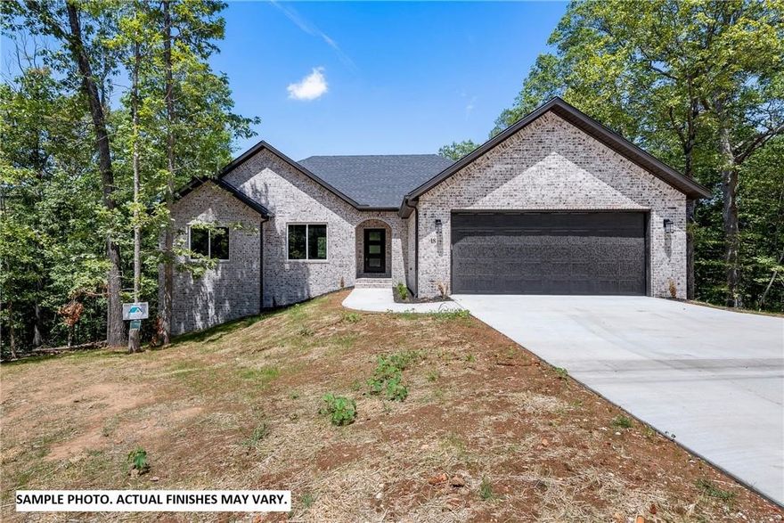 Beautiful new construction by Elite Thomas Homes. Estimated completion date is the end of August 2025. Get under contract early to choose some finishes and/or upgrades. Photos are of similar homes and finishes may vary. Home is less than 1/2 a mile to the Back 40 Buckingham trailhead and only about 1 mile to Lake Ann! Main level will have 2 bedrooms and an office, 2 bath, and oversized 2 car garage. Open concept floor plan with spacious kitchen, living room, and dining room. Vaulted ceilings with beams in the main area and a stack stone gas fireplace. Access the large covered and uncovered deck from kitchen. Large primary bedroom with walk-in closet.Primary bathroom has a dual vanity, tile shower, free standing tub and separate toilet room.  Bedroom 2 and the office are on the other side of the home with a nice hall bathroom  Partial walkout basement will have a larger media/gameroom with bar area,3rd bedroom with walk-in closet and bathroom with fiberglass shower. Also enjoy the 2nd covered deck from the basement.