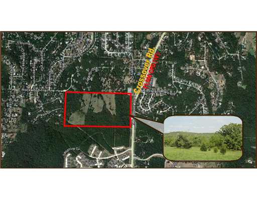 Located near the newly constructed Happy Hollow Elementary. Close proximity to Walmart Neighborhood Market, Harp's Grocery, several banks, Stonebridge Golf Course, restaurants, etc.,Bank owned with financing available for approved Buyer. Ideal for Investment, single-family development or estate lots.