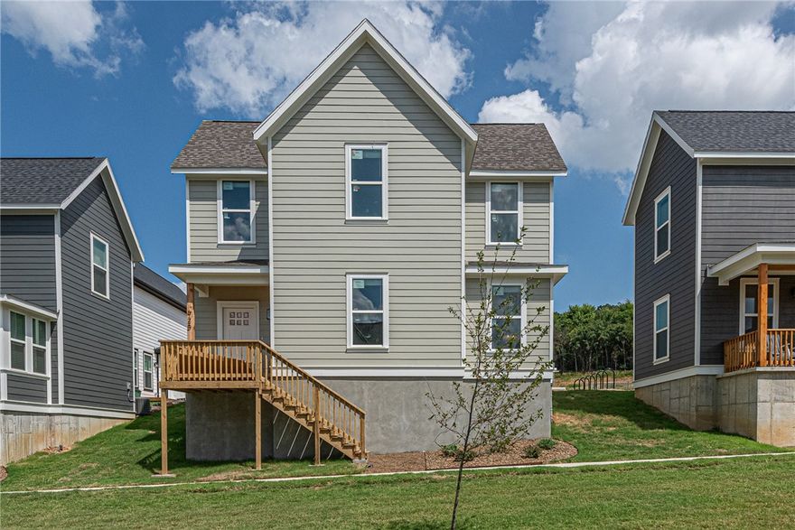 $3,500 LENDER CREDIT offered with buyer’s use of builder’s preferred lender - Use towards rate buydowns or closing costs! (OPEN HOUSES hosted @ MODEL HOME: 1015 N Laramie Heights) Welcome to Southern Woods! A Trailside Community at the base of Centennial Park 2022 Top Outdoor Facility Rating) Location offers access to miles of trails, greenspaces w/ paved pathways, & bicycle stalls, min away to shopping, food, I-49, & U of A campus! 3 BEDROOM PROW COTTAGE floor plan feat: a covered front porch w cedar post, open concept 1st floor w 9’ ceilings, LVP floors, & kitchen w 3cm granite counters, tiled backsplash, center island w sink, stainless steel appliances! Main floor primary bedrm w/ ensuite bathrm! Upstairs 2 more Bedrms w private ensuites & laundry rm! Main floor back deck! POA $35/mo incl lawn mowing! Join this community in a premier location today!