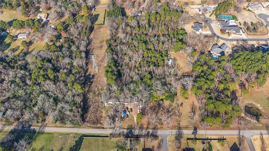 10 beautiful acres in one of Russellville's most desired areas. Perfect setting for a new custom home or  subdivision.  This private and scenic setting is secluded but yet just minutes from downtown.  An easement is already in place in Hilltop Summit Estates to connect to utilities.  This is a rare opportunity to have 10 acres in the city limits.