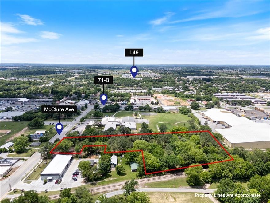 Sewer and water ON SITE!! Positioned just off 71B on McClure Avenue in Lowell, this vacant 5.30 MOL acre lot offers unmatched development potential in one of Northwest Arkansas’ most central and fastest-growing areas. Zoned C2 per the City of Lowell, the property is ideal for a range of uses—including warehousing, storage units, or other investment-driven projects. The lot is ready for your vision, with the previous structures recently removed for a clean slate. Enjoy convenient access—just 7 minutes to I-49—making this a strategic hub for logistics, service-based businesses, or future commercial ventures. Don’t miss your chance to secure land in one of the most high-demand pockets of NWA.