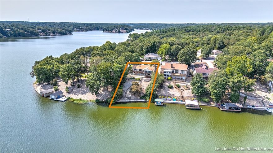 Freshly updated, this move-in ready lakefront gem on Loch Lomond offers stunning lakefront panoramic lake views with easy, direct lake access providing the ultimate waterfront lifestyle. The main level shines with a bright, open layout featuring cathedral ceilings, floor to ceiling windows, and spacious living and kitchen area. Enjoy lake views from the kitchen, eat in dining area and sunroom.  The walk-out lower level expands your living space with an oversized family room, wet bar, two bedrooms, full bath, oversized workshop with exterior access, and a secure storage/safe room. Step outside to relax or entertain on the freshly refinished composite deck and covered patio while soaking in serene lake views. Exceptionally maintained, thoughtfully upgraded, with lakefront charm all combines for a home that’s ready to enjoy today.