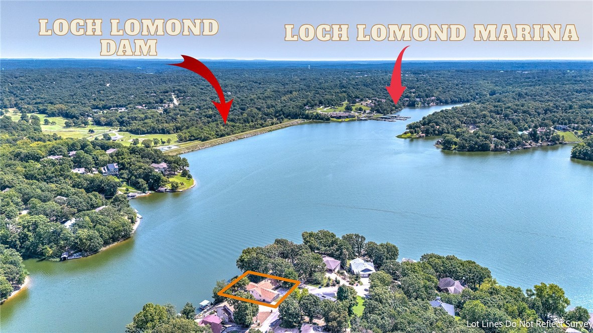 Freshly updated, this move-in ready lakefront gem on Loch Lomond offers stunning lakefront panoramic lake views with easy, direct lake access providing the ultimate waterfront lifestyle. The main level shines with a bright, open layout featuring cathedral ceilings, floor to ceiling windows, and spacious living and kitchen area. Enjoy lake views from the kitchen, eat in dining area and sunroom. The walk-out lower level expands your living space with an oversized family room, wet bar, two bedrooms, full bath, oversized workshop with exterior access, and a secure storage/safe room. Step outside to relax or entertain on the freshly refinished composite deck and covered patio while soaking in serene lake views. Exceptionally maintained, thoughtfully upgraded, with lakefront charm all combines for a home thatās ready to enjoy today.
