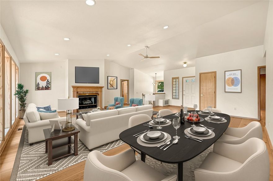 Bring offers! Motivated seller! This beautifully refreshed, move-in ready waterfront retreat on Loch Lomond delivers panoramic lake views and easy, direct water access—your gateway to the ultimate lake lifestyle. The main level shines with a bright, open layout, cathedral ceilings, and floor-to-ceiling windows that frame views of the water. The kitchen, eat-in dining area, and sunroom all capture the serene lake setting, making everyday living feel like a getaway. The walk-out lower level provides exceptional flexibility with an oversized family room, wet bar, two bedrooms, full bath, and an expansive workshop with exterior access—plus a secure storage/safe room. Step outside to enjoy multiple outdoor living spaces, including a freshly refinished composite deck and a covered patio perfect for relaxing or entertaining while taking in the peaceful lake surroundings. Exceptionally maintained, thoughtfully updated, this lakefront gem blends comfort, charm, and waterfront living at its best—ready for you to enjoy today.