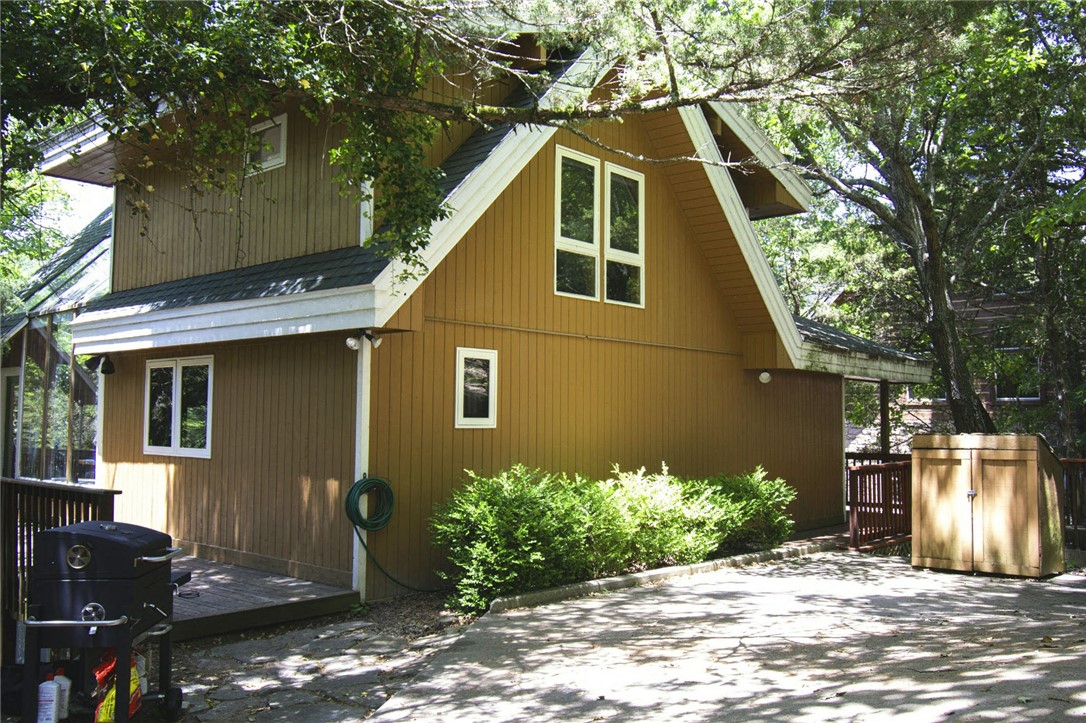 Escape to your new Lost Bridge lake home or Airbnb water front paradise on Beaver Lake! Enjoy stunning views, fishing, kayaking, or simply relaxing all just steps away from the waters edge. This cozy gingerbread cabin features a spacious living area, fireplace, a fully equipped kitchen, comfortable bedrooms, sauna and 6 person hot tub with an outdoor shower. This very profitable Airbnb with 69k ROI in 2024, sleeps 10 and just had a kitchen remodel 3 years ago with stainless steel appliances. Not only does it have cedar throughout the home, it has skylights in the living and dining room to enhance the stone flooring and cabin features. So, now can you imagine your evenings on one of the two decks, or sitting by the fire pit enjoying the lake breeze and breathtaking sunsets? With a community pool, boat ramp, tennis courts and hiking trails all near the state park? This Stitt built home was designed to minimize environmental impact and promote a healthier lifestyle. It's time to make waves and host your next guest.