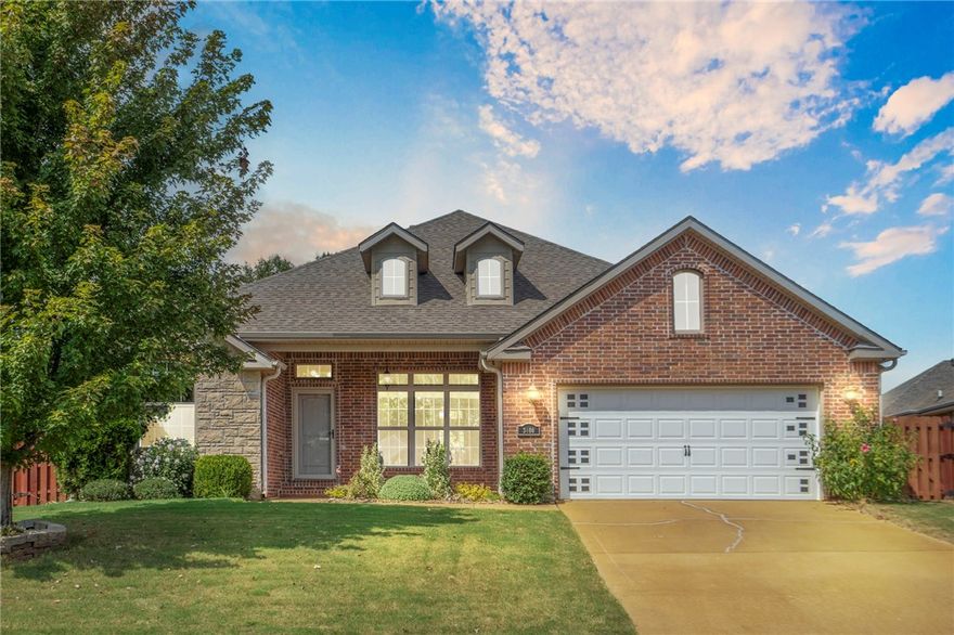 Come see this charming single-level brick & stone home in a prime Bentonville location! Step inside to a bright, open floor plan with rich hardwood floors and abundant natural light. The living room features a cozy fireplace, while the modern kitchen has granite counters, stainless steel appliances, and a 5-burner gas range. The split floor plan offers a private primary suite with a soaking tub, separate shower, and a huge walk-in closet. Living space extends outdoors to a large patio with a stunning cedar pergola, all within a fully fenced backyard perfect for entertaining. Enjoy an easy walk to the elementary school and fantastic community amenities, including a pool and playground. This meticulously maintained home is a true gem.