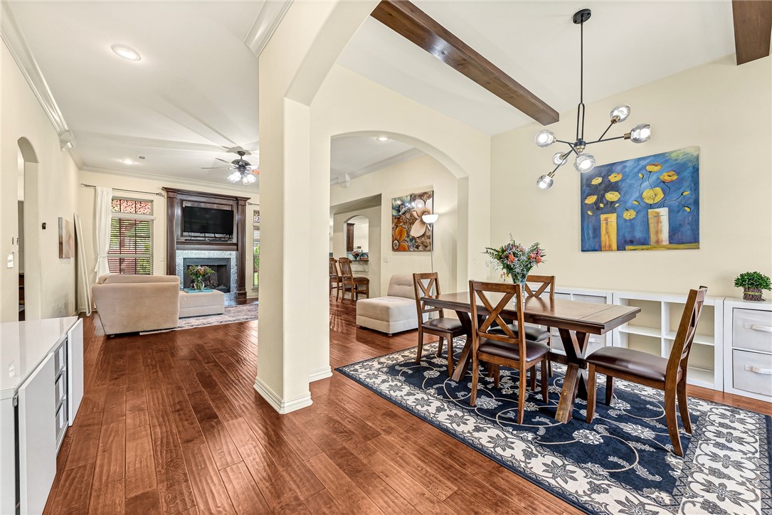 Come see this charming single-level brick & stone home in a prime Bentonville location! Step inside to a bright, open floor plan with rich hardwood floors and abundant natural light. The living room features a cozy fireplace, while the modern kitchen has granite counters, stainless steel appliances, and a 5-burner gas range. The split floor plan offers a private primary suite with a soaking tub, separate shower, and a huge walk-in closet. Living space extends outdoors to a large patio with a stunning cedar pergola, all within a fully fenced backyard perfect for entertaining. Enjoy an easy walk to the elementary school and fantastic community amenities, including a pool and playground. This meticulously maintained home is a true gem.