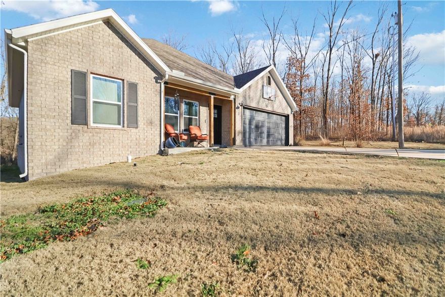 Beautiful home on a quiet large corner lot, conveniently located close to town and nearby bike trails. Featuring 3 bedrooms, and a separate hobby/office space for flexible living. The living room features vaulted ceilings and a cozy electric fireplace, opening to a modern kitchen with an eat-at island, beautiful granite countertops, walk in pantry and soft-close cabinets.
The primary bedroom includes a tray ceiling, walk-in closet, and a bathroom with double sinks and a custom tiled shower.

 Additional features include LVP flooring throughout, window blinds, a mud bench at the garage entry, a covered front porch, covered back patio for relaxing, and a 2-car garage.