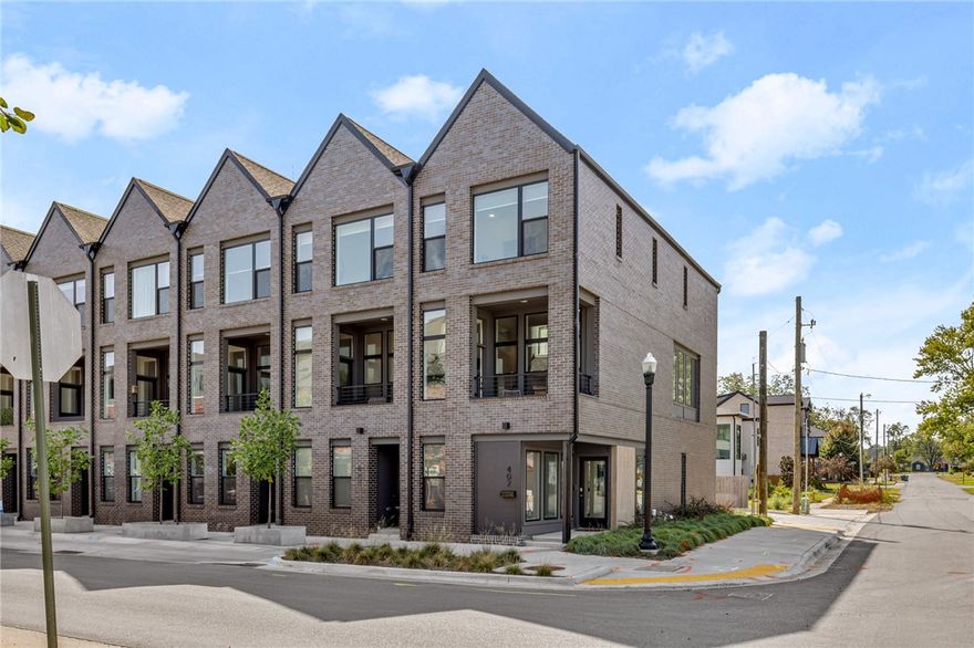 Turn-key townhome in the heart of Downtown Bentonville! 3-level property offers 3 beds & 3 baths across 1,683 sq ft. 1-car garage includes storage & EV charger. Enjoy downtown views from the spacious, private covered patio. Corner unit provides extra privacy & natural light. Landscaped yard & contemporary exterior add curb appeal. Main level features foyer, full guest suite & garage entry. The suite has a separate entrance, perfect for a rental or office. Second level offers bright, open living spaces, including kitchen w/quartz counters, stainless appliances & abundant storage. Large dining area and living room w/patio views are ideal for entertaining. On the third level, find the primary suite w/luxurious bath, WIC, and space for an office or sitting area, plus another guest room and bath. Fully furnished, this turn-key property is perfect for investors or buyers. Located in a prime area, Skylight Cinema, The Ledger & A St right out your door. Secure this property now for a valuable investment or personal home!