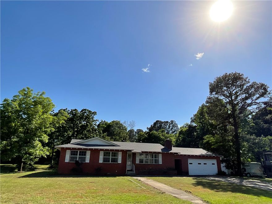 Welcome Home to this freshly painted farmhouse thiem remodeled beauty in the city limits of Clarksville walking distance to the University of the Ozark resides this 2360 ft.² under roof home on almost an acre of land that is manicured. Sit on your covered back porch that overlooks your wet weather creek and also a quaint barn. This spacious three bedroom two bath home has been newly remodeled with a freshly painted white kitchen, new backsplash and touchless sink faucet ,Gas range, Dishwasher and Refrigerator and solid surface countertops. Also both baths have been remodeled. Enjoy and a barn wood Thiem throughout. Also this home offers a 22X22 detached garage connected to the home by a spacious breezeway. A lovely corner Fireplace viewable from the dining room and living room areas. There are multiple pocket doors and Cedar line closets. Make this your new home and call for your showing today!