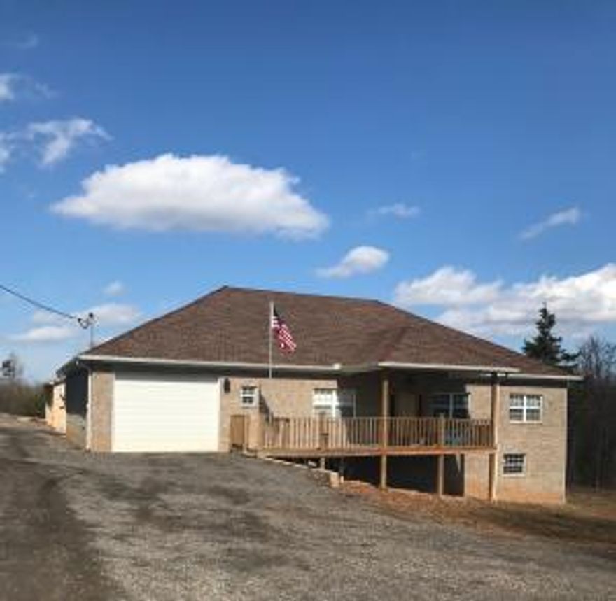 beautiful house with custom design 2 years old, has 3 bed/2baths  and two half baths, formal dining, living room and family room, well insulated, central a/c and heater with dual control and 5 ton unit, house sits on 6+ acres. House also has a lower level almost finished with separate entrance, a shelter room (12X16) that can be used for food storage( emergency access from inside of the house). Garage is drive thru 12 feet tall (16w,500L) with 9 feet insulated door. House comes with a nice concrete patio 50X36 and a Mancave  36x36 with electricity and sewer connections for RV (30 AMP) there is also water sewer and electricity installed.  A lot of extras you need to see it!.
