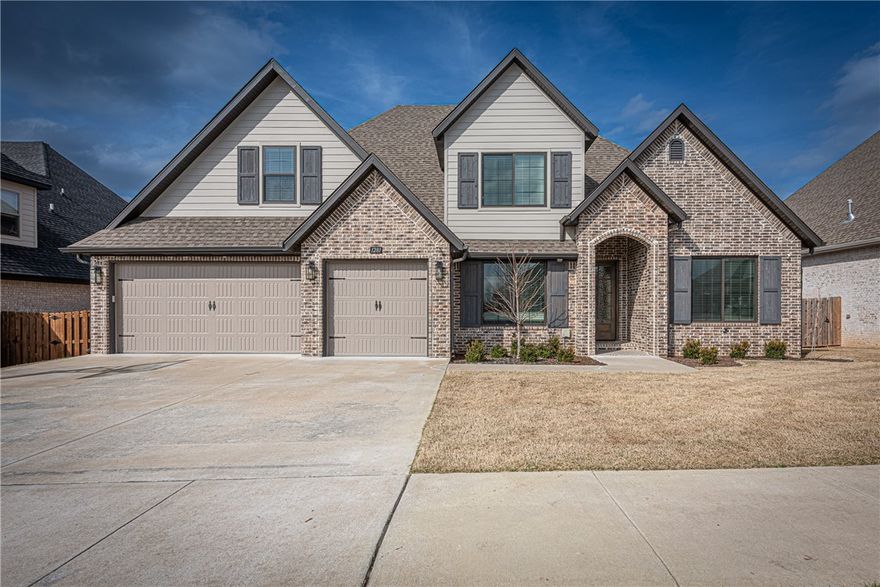 This 4 BR, 3 BA home on 0.30 acres built in 2022 is located min from parks, schools & a short drive to I-49, & XNA. Beautiful front landscaping leading to the covered front entry. Spacious living area w/ hardwd flrs, crown molding & gas log fireplace. Open kitchen & dining w/ quartz counters, stainless apps, flat-front cabinetry w/ soft-close cabinets & drawers, pull-out shelves & island. Butler’s pantry connects to frml dining w/ wainscoting details. Large main-level primary suite feat: dual sink vanity, walk-in shower, soak tub & walk-in closet w/ pass-through to laundry. Addt’l bedrm & full bath on main flr. Upstairs 2 bedrms, full bath & bonus rm for flexible living. Covered patio w/ epoxy floors overlooks beautifully landscaped privacy-fenced backyard w/ room for a pool. ADDT'L FEAT: 10x10 storage bldg, insulated garage w/ epoxy flrs, Pella double insulated windows ('23), wired for sound, extra insulation in walls & attic, basketball mount at drvwy, smart home feat- front door locks, garage door & thermostats!