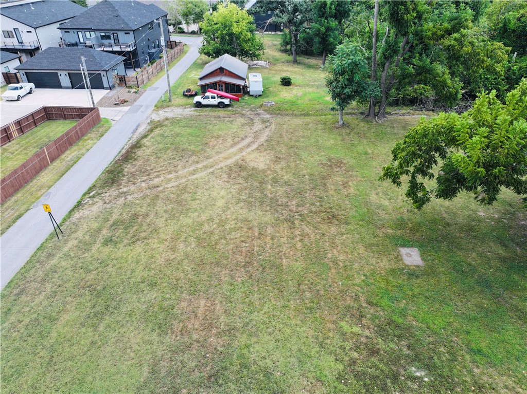 Ready for your Next Home and more! Situated on 3 platted lots and rezoned DN-2, this beautiful downtown parcel is a developers dream and, when combined, can be split into 5 lots. Buy one lot and build your dream home with an ADU or a duplex for income generating potential, or buy them all and let your imagination run wild in a quickly appreciating neighborhood. With 3 major trailheads and new Skybridge just down the street, within minutes you can walk or bike to the Bentonville Square, Crystal Bridges, Park Springs Park, the Razorback Greenway & Slaughter Pen bike trails and enjoy all the best of Downtown Bentonville, all while enjoying a quick 10 minute commute to the new WM Campus