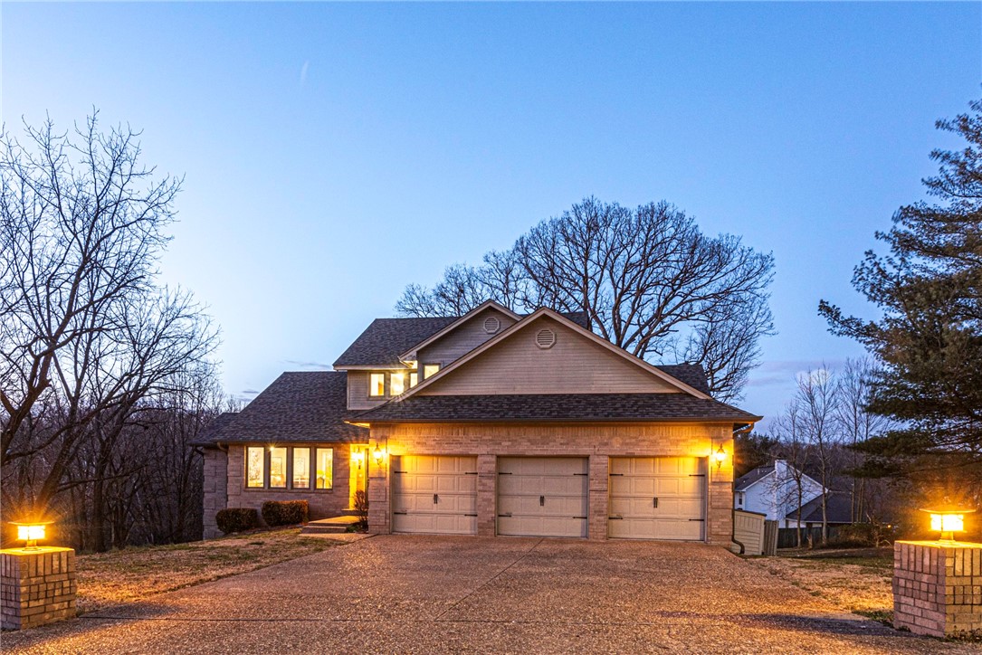 Welcome home! This 5 bedrm 3.5 bathrm home on 0.71 Acres +/- is located near Downtown Bentonville, Walmart Home Office & Future Campus, Coler Mountain w/ lots mountain biking trails! Inside enjoy a front living room w/ dining space that opens to main living space feat: second living rm with/ wood floors & fireplace, U-shaped kitchen feat: granite counters, counter peninsula, & stainless steel apps, & a stunning all glass sunroom! Rejuvenate in the main flr primary bedrm w/ deck access, walk in closet, & a private ensuite feat: jacuzzi tub, shower, & double sink vanity! Upstairs: reading loft w/ built-ins, 3 bedrms, & 1 full bathrm! Walkout Basement: 1 bedroom w/ patio access, a large rec rm w/ french doors to patio, wet bar w/ peninsula PLUS a den w/ media room potential! Backyard features multiple deck areas & a private in ground pool with iron fence to enjoy this summer! UPDATES: new roof in 2023, Fresh paint & New carpet through the home! Don't let this opportunity go! Act now!