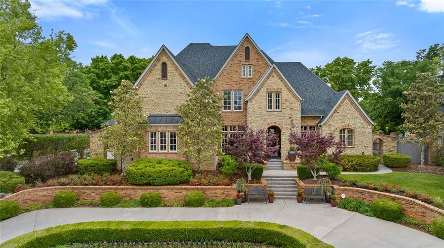 Behind the desirable gates of Pinnacle Country Club, you will find this exquisite estate towards the end of a quiet lane. Immediate curb appeal will get your attention as you pull into the front circle drive with raised lush landscaping beds. Entering, you will see a grand staircase, abundance of natural light coming into the family room, a private office with built ins, designer dining room & butlers pantry.  Continue into the large gourmet kitchen overlooking a warm & inviting hearth room with fireplace and lovely breakfast room with sliding exterior doors. The elegant master suite offers private access to the terrace and a luxurious ensuite bathroom. You will also find an additional bedroom suite on the main level. Second level hosts three bedrooms suites, second laundry room, theater, game room, & half bath!  The backyard is breathtaking- a spacious covered veranda w/fireplace, & a courtyard with built in grilling station- all overlooking the perfectly manicured lawn & hedges. Four car split garage.