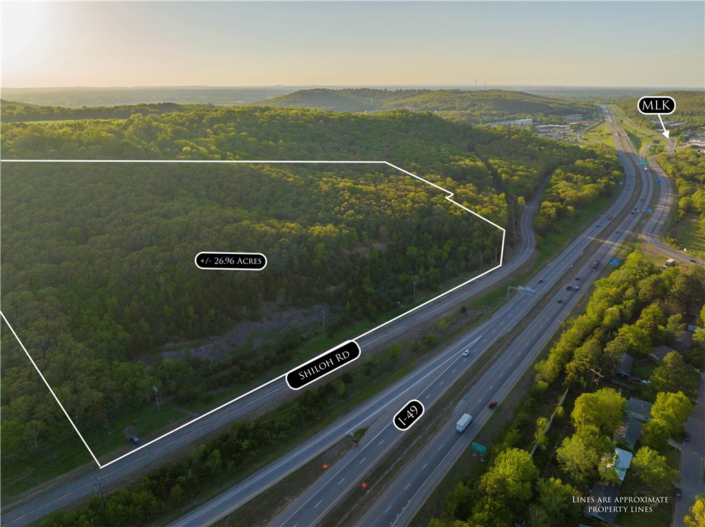Welcome to an unparalleled opportunity for commercial development or any venture of your choosing! This pristine 26.96-acre parcel of wooded land, nestled in the heart of Fayetteville, is a developer's dream come true. Situated just off I-49, this prime location offers unrivaled visibility and accessibility, making it an ideal spot for businesses seeking maximum exposure. Strategically positioned near the U of A, this property promises a steady stream of potential customers & endless possibilities.