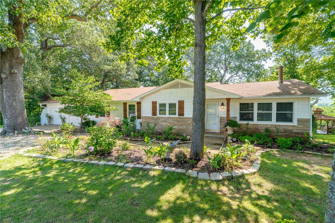 Homestead next to the White River with beautiful views of JB Hunt Ranch. Very cozy 3BR, 2B, 2 car garage, 2 living areas, nice kitchen with lots of cabinets, updated granite counters with bar area. Formal dining room, split bedrooms all on 3.94 acres. New insulation, gazebo, fruit trees, etc.