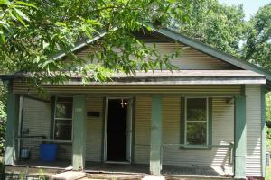 Larger and deep lot, storm shelter, and rear covered patio. Nice kitchen, tall ceilings, lots of kitchen cabinets. East side of lot has a detached garage and a storage shed. Roof of home was inspected and in good condition. Roof on back porch needs replaced. HVAC was new compressor. Living room has hardwood floors. Island has a butcher block top. Home has all new sheet rock. AS IS--NO EXCEPTIONS