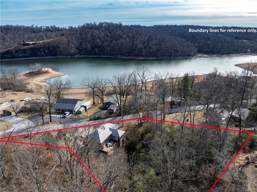 MODERN LAKE LIVING! Discover 13934 Canal St in the sought-after Monte Ne Shores—a versatile gem perfect as a TURN-KEY short-term rental, secondary retreat, or permanent residence. This 3BR/2.5BA home features a sleek, modern interior and a main-level balcony made for sunset views. The kitchen is a standout, featuring a dedicated coffee bar and pantry. Retreat to the private basement-level Master Suite, a true sanctuary with a full ensuite, walk-in closet, and dedicated office space. This home is built for efficiency and comfort with a NEW furnace, NEW washer/dryer, and a high-efficiency outdoor wood furnace as an additional heating option! Outdoor living is elevated with a fully fenced yard, hot tub, smoker/grill, and abundant seating. The garage offers flexible space for parking or a game room. Best of all, public lake access is just a short walk or golf cart ride away. Sold FULLY FURNISHED and ready to perform or enjoy. Experience the best of Beaver Lake with modern style and total peace of mind!