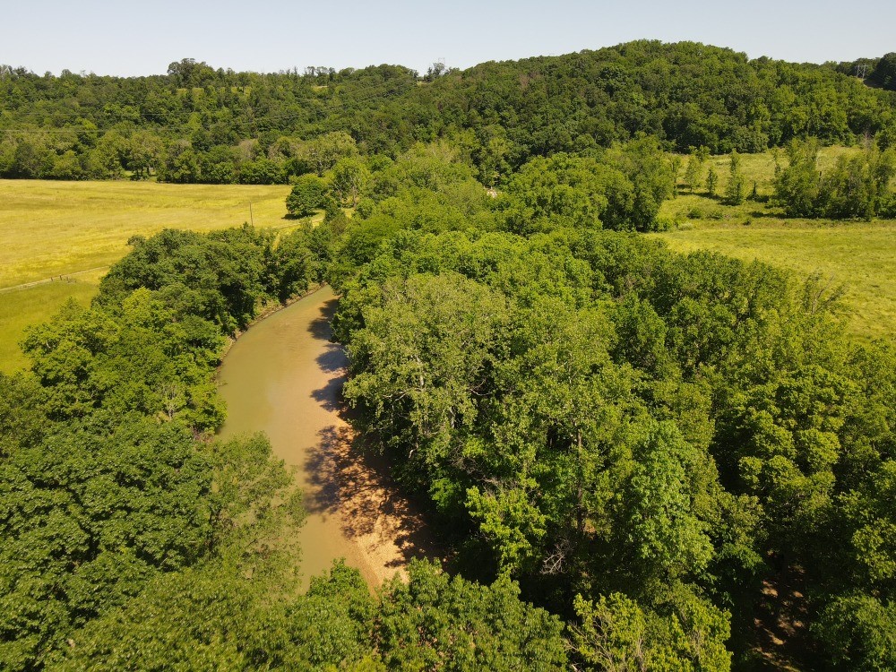 Discover 10 acres of stunning Spavinaw Valley beauty with Spavinaw Creek meandering through the property—creating the perfect backdrop for your dream retreat or hobby farm. This peaceful, quiet setting offers a blend of open lush grass and scattered mature trees, ideal for grazing, gardening, or simply enjoying the serenity of the countryside. With multiple building sites available, you’ll have the flexibility to create your perfect homestead, weekend getaway, or recreational escape. Whether you're envisioning a small farm, a cozy cabin by the creek, or just a quiet place to unwind, this property delivers endless potential in a truly scenic location.