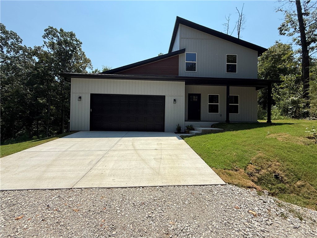 Be the first to own this beautifully designed modern home on the east side of Bella Vista. This two-story, 3-bedroom, 2.5-bath home features a spacious open floor plan, perfect for both everyday living and entertaining. The kitchen offers ample space with an island, pantry, custom cabinetry, stainless steel appliances, and granite countertops throughout the home.
The main-level primary suite includes luxury vinyl plank wood flooring, a walk-in closet, and an en-suite bath with double vanities, a soaking tub, and a separate shower. Upstairs, two generously sized bedrooms feature lush carpeting, large closets, and share a full bath with double vanity and a tub/shower combo.
Enjoy two covered porches, a two-car garage, and a large yard—ideal for outdoor living. Located just minutes from bike trails, lakes, golf courses, and more, this home blends modern comfort with the natural beauty of Bella Vista.