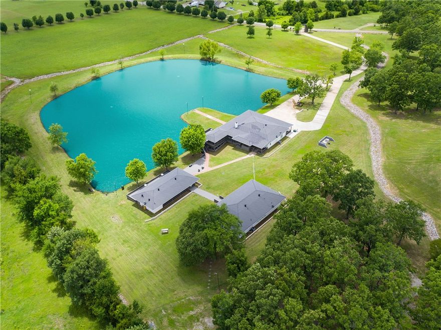 Perfect place for a wedding venue or corporate retreat. 2 homes, remodeled & updated. Huge private lake, party pavilion, 3 sides with lake view, decks,, top of the line everything, granite, engineered plank floors, 4 ovens in main house, bar for eight, crystal chandeliers, & much more.