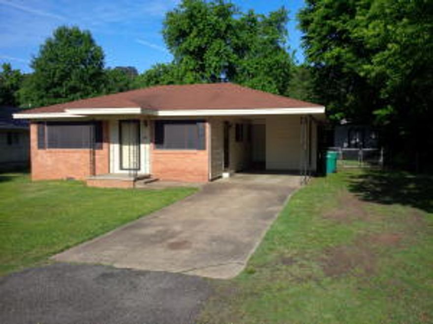 NICE 3 BEDROOM, 2 BATH HOME WITH A SINGLE CARPORT, LARGE FENCED BACKYARD  & A STORAGE BUILDING.