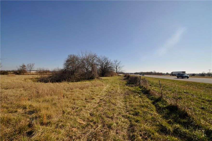 390FT OF I-49 FRONTAGE AND 274FT OF 26TH STREET FRONTAGE. ADJOINING LAND ON THE NORTH AND SOUTH SIDE AVAILABLE. ZONE C-4. DEVELOPMENT OPPORTUNITY.