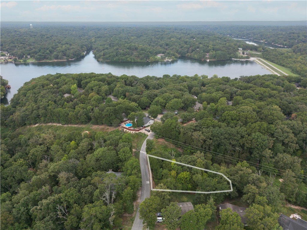 Discover a rare gem in Bella Vista - a beautiful, large lot just moments from Tunnel Vision Trail and within proximity of Lake Windsor. This lot is as leveled as Bella Vista gets, this prime piece of land is the ideal spot to build your dream home. Don't miss this unique opportunity to create this place your home.
***Water and electricity at street***