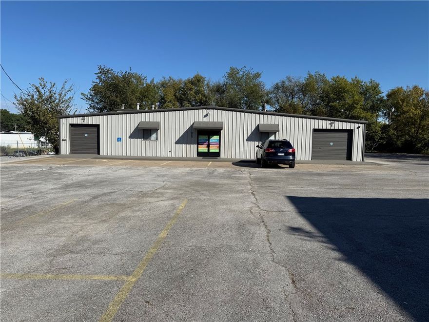 4,156+/- Sq ft warehouse and a 5,600 +/- Sq Ft warehouse on 1 acre right off 71B in Springdale.  The front building was previously an automotive shop. The back building is leased month to month and built out for a church. Multiple possibilities to make this property exactly what you need.Completely paved parking lot. C5 Zoning. Sold as is
