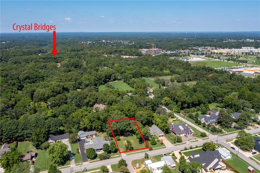 This is the BEST building lot in Downtown Bentonville! Premium location and address and truly walking distance to the Bentonville Square, Crystal Bridges, The Momentary and all the things that make you want to be close to and a part of the dynamic community!   Lot is .34 of an acre and has beautiful Huge Mature Trees and backs up to forever privacy.   This is THE LOT you have been waiting to build on in the most sought-after location in Downtown Bentonville.