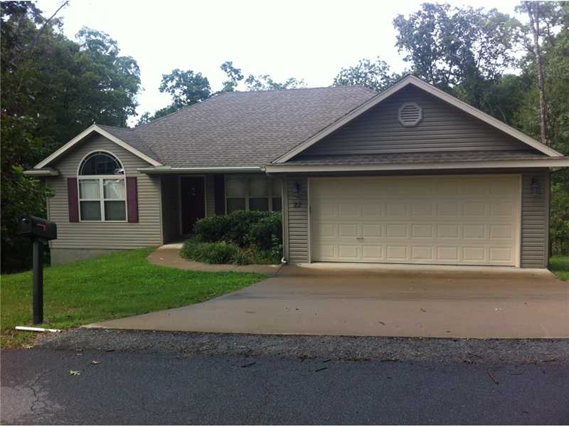 A huge house in a nice area. Great floor plan with lots of windows. A very nice deck overlooking a lawn and covered area, and cathedral ceilings.