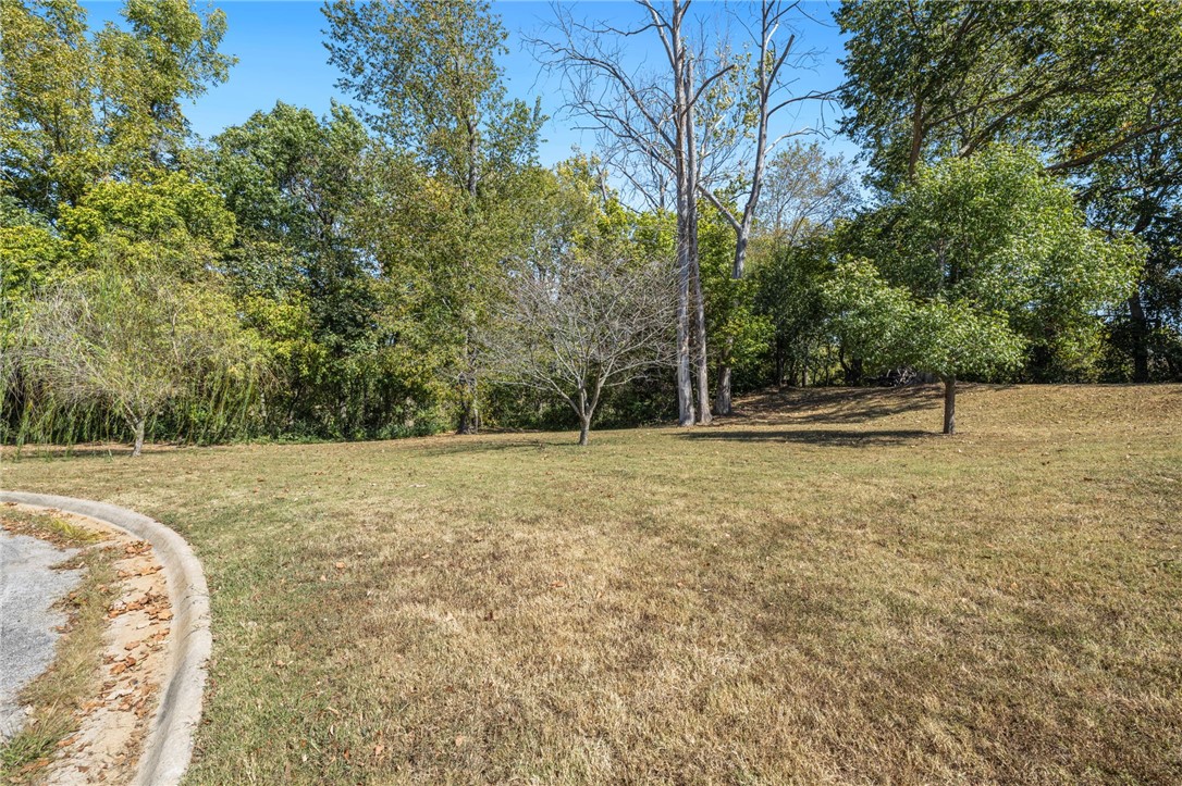 Build your dream home on this stunning .38-acre lot in Fayetteville! Imagine living just steps away from the beautiful Bayarri Park, complete with a playground and direct access to the White River. This lot nestled at the end of a peaceful cul-de-sac and backed by lush woods, offers a serene retreat while being minutes from downtown Fayetteville and the University of Arkansas. The architect the sellers consulted with were super positive about working with the natural slope. With city water and sewer available at the street and surrounded by a neighborhood trail perfect for running, biking, or leisurely strolls, this location truly has it all. Plus, the park is permanently protected as P-1 Institutional, ensuring your views will never be obstructed. Donāt miss out on this incredible opportunityācome see this beautiful lot today!