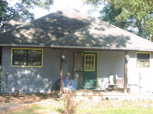 Very nice unique home on almost over 18 acres. Only a little over one mile from pavement and just 7 miles from Jasper. 3 bedrooms and a large room in the basement that could be made into a 4th bedroom. 2 bathrooms. Nice workshop on property. Large finished basement area with a safe room. Nice pasture area with some fencing. Rural water and electric and propane. County road frontage. Call today!