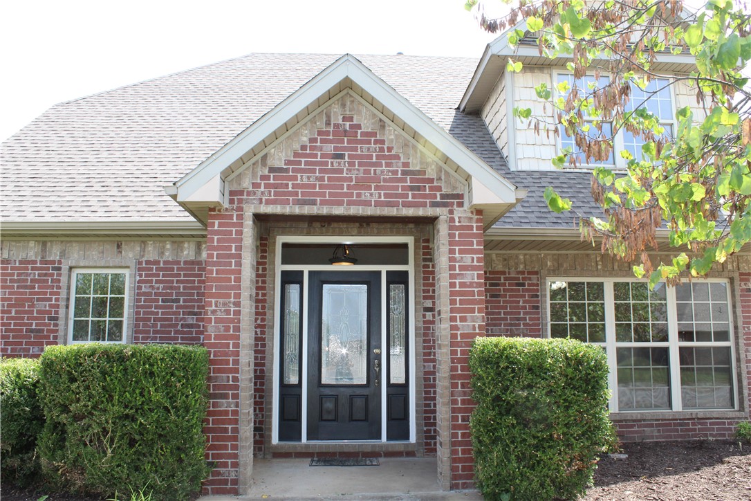 Location is key! and this West facing home is centrally located between Bentonville and Centerton. Recently upgraded with new carpet and fresh paint and boasting 4 bedrooms and 2 1/2 bathrooms! Living area is spacious with abundant natural light and a gas log fireplace. Kitchen offers stainless steel appliances, granite counter tops, and ample cabinet space. Dining and breakfast areas are easily accessible from the kitchen and have large windows for plenty of natural light and a view of the backyard. Primary bedroom is conveniently located on the main level and features an en-suite bathroom and large walk in closet with a window. There is a fully fenced backyard with large concrete patio space for your enjoyment or entertaining. The garage has an epoxy floor and the second parking space is extended length. Storage shed does convey.