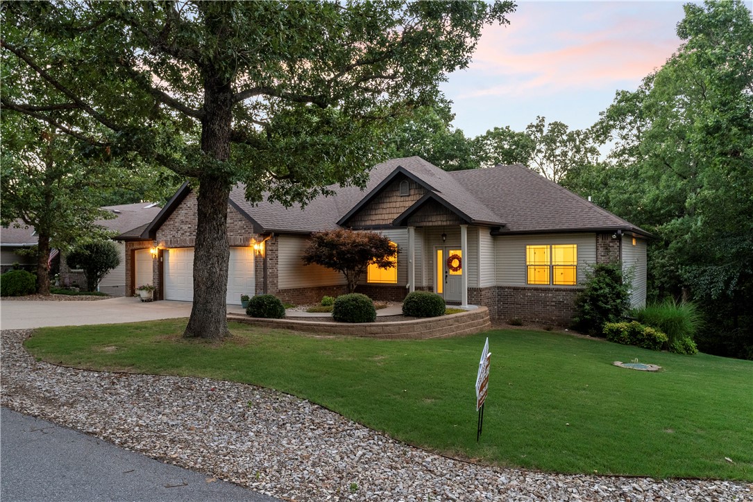 Discover this charming, remodeled Bella Vista home featuring a rare 3-car garage! Nestled on a tranquil lot abundant with wildlife, this 3-bedroom, 2-bath gem offers a split-bedroom layout for privacy. Enjoy proximity to amenities like a dog park, golf courses, shopping, and easy interstate access. Recently updated with new hardwood floors and luxury vinyl plank in the baths, and new butcher block counters, a luxury stand alone tub and more. There is a pot filler above the stove and a new kitchen sink. Outside, admire the beautiful landscaping. Don't miss out on this dream homeāschedule your showing today! Pizza oven in garage included.