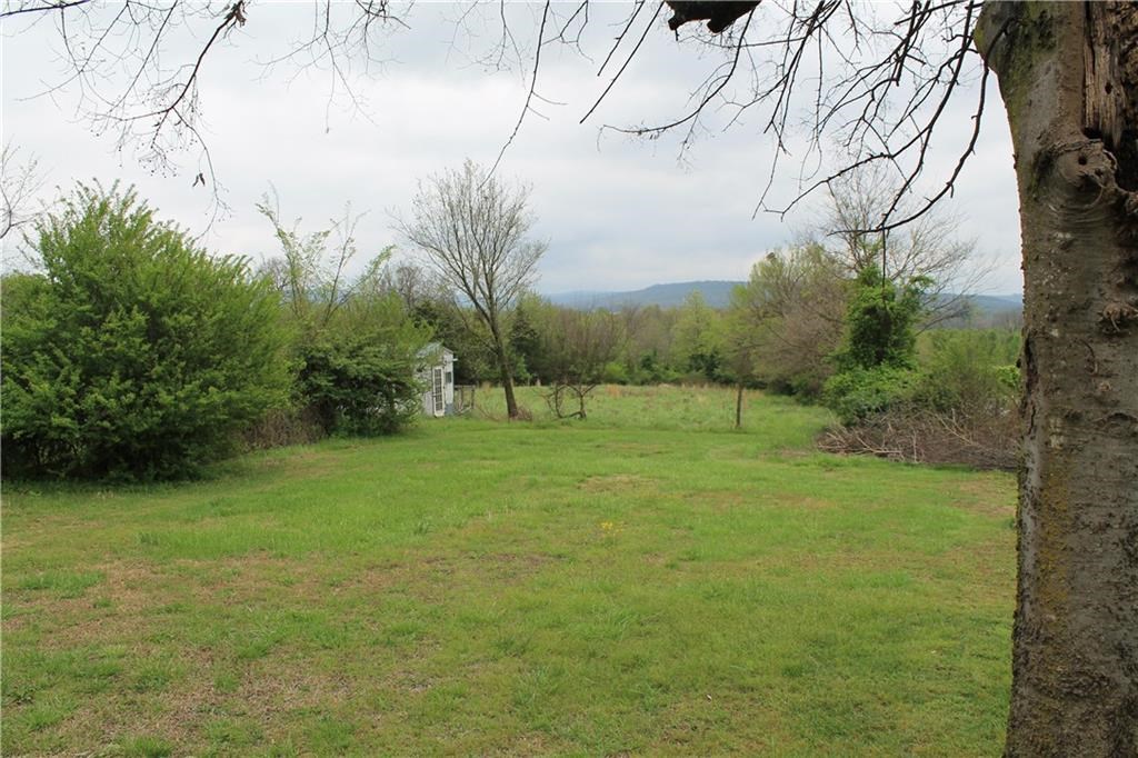 1.6 acres near downtown potential investment or development opportunity! All value given to the land, no value given to the mobile home. Mobile is liveable, could rent while deciding on development.