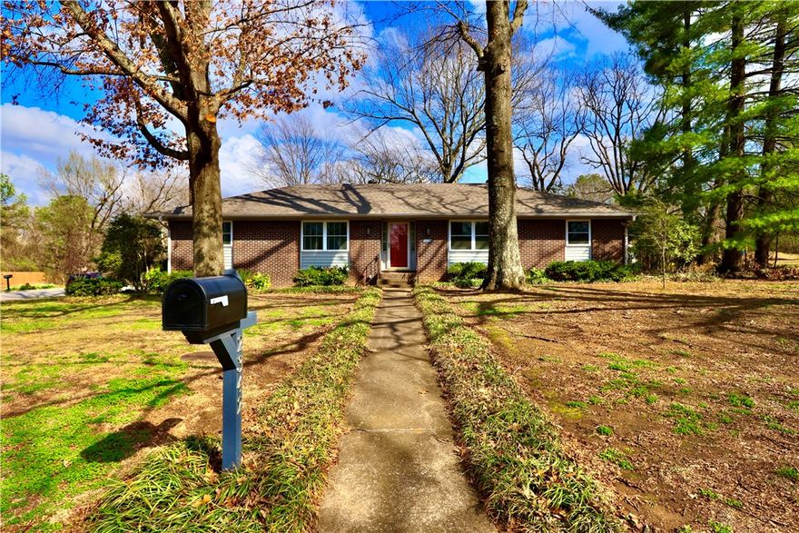 Highly desirable East Fayetteville location just two blocks from Gulley Park. Situated on a large corner lot with mature oaks and pines, this property offers ample space for outdoor additions such as a pool, expanded patio, or garden.

The 3-bedroom floor plan has been thoughtfully modified, combining two bedrooms to create a spacious suite with a separate sitting room and closets in both areas. The layout allows for easy conversion back to two separate bedrooms if desired.

Backyard features include a large wooden deck and fire pit area ideal for outdoor entertaining. The living room offers a wood-burning fireplace that is already plumbed for gas logs.

Recent updates include newer roof, HVAC system (furnace, A/C, and ductwork), gas line from meter, gas range and oven, vent hood with microwave, hot water heater, and washing machine. All appliances convey.

Rare opportunity in an established East Fayetteville neighborhood within walking distance to Gulley Park.