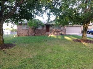 Wonderful single family ranch style home that contains 1,551 sq ft located on the north side of town, close to shopping and dining, with easy access to Hwy 65. It is a 3 bedroom and 2 bath home, with a two car garage, located in a peaceful neighborhood. The house has a large fenced in back yard with a privacy fence on one side, and has a cedar wood play set and a raised garden bed. There is also a large wooden deck where you can relax in the evenings and watch the lights of town. The living room has new laminate wood flooring and a wood burning fire place that has built in shelving. The open kitchen and dining room, that has a built in dry bar, makes meal preparation and family dinner joyful. Kitchen has all stainless steel appliances that stay with the home.