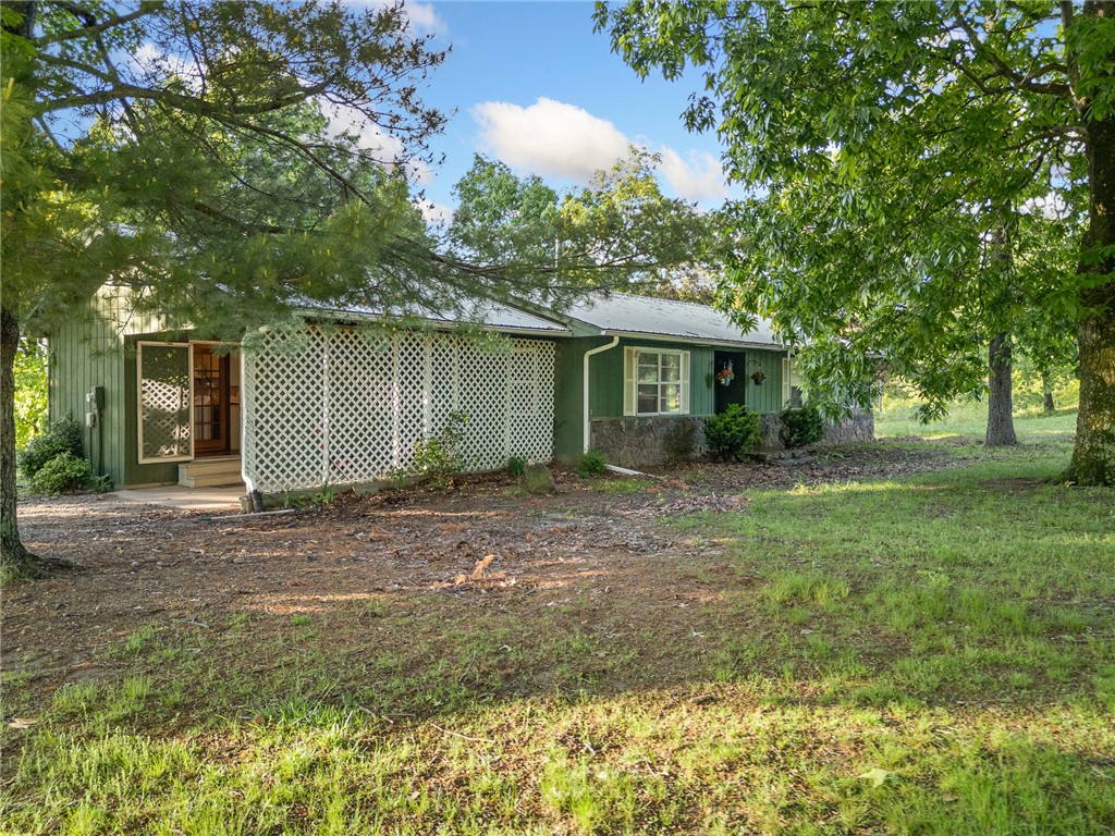 Welcome to your new retreat! 4.19 m/l beautiful acres, just a few minutes south of Jasper! This 3-bedroom, 2 bathroom house has all the makings for your next home or vacation home in beautiful Newton County! The Property includes multiple outbuildings for all the storage you could need. The back deck has views across the mountain valleys, showing off the beautiful sunsets of the Ozark Mountains. This is a one-of-a-kind property near hiking trails, the Buffalo River, and everything else Jasper has to offer!