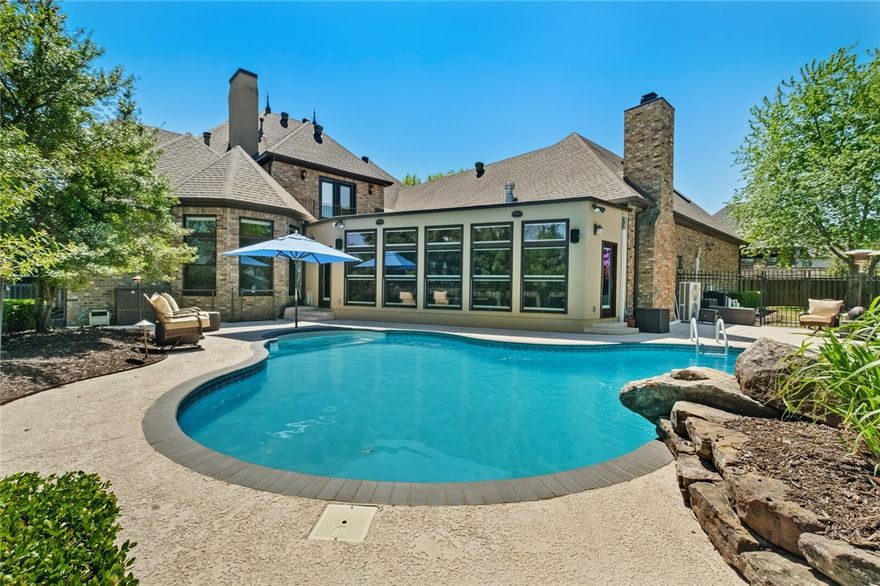 This stunning home in the highly sought after St. Valery Downs gated community in Bentonville features 5 beds, 4.5 baths, over 6,423 sqft and a 3 car side load garage. You will love entertaining friends and family in an amazing living area overlooking the pool with an outdoor kitchen! Carry on with family dinners in the formal dining room or make your own workspace in the one of the “flex rooms”. Enjoy the heated pool with waterfall/slide, pool room/bathroom and mudroom. Welcome Home!  **Seller to give $10,000 buyer concession.**