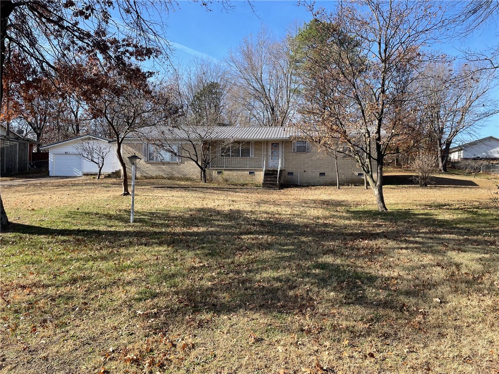 1842 sq. foot Brick home located in a great location. 2 bedroom and 1 bath however there is an extra room that could be used as a bedroom. Open floor plan and home has beautiful wood floors. Home has an extra big room that could be used as a game room or Family room. Property has a detached one car garage with a storm shelter room that is ground level. Home is located right across the road from the City soccer field and Community center. Home needs some updating. Home is being sold (AS IS )