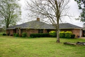 Looking for a huge house on a large plot of land with beautiful vistas completely surrounding you? Look no further, as soon as you turn onto the long drive leading to this brick home you can feel the calmness of nature surround. This property is perfect for horses, full fenced and cross fenced with a 36' x 51' barn with stalls, a brick 30' x 30' shop, 12' x 12' storage building, and two ponds. The home itself is not to be overlooked either. Everything is oversized you have multiple living or multi purpose spaces, large bedrooms, oversized closets. If you are feeling cramped this is just the upgrade you need. Call for your showing today, not too many options like this on the market.