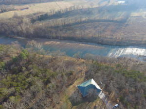Sit and enjoy great views of the Kings River from your covered deck as you watch the sunset. Fish and Float from your property with your own stairs down to the water. Located just under 2.5 miles by river above the Romp Hole Game and Fish access and just over 2.5 miles down river from Stoney Point. This newer home is 3BR, 2.5BA split floor plan with large living room with vaulted ceilings, wood stove, kitchen has custom oak cabinets with stainless dishwasher, microwave, stove and hood, sun room, office, large master suit with walk-in closet, 2 sinks, whirlpool tub and shower, Jack & Jill bath between guest BR's, new 30x50 insulated shop with electric, 14 foot door with opener for storing your boat, RV, or other toys with plenty of room for workshop space. All located on 10 acres.