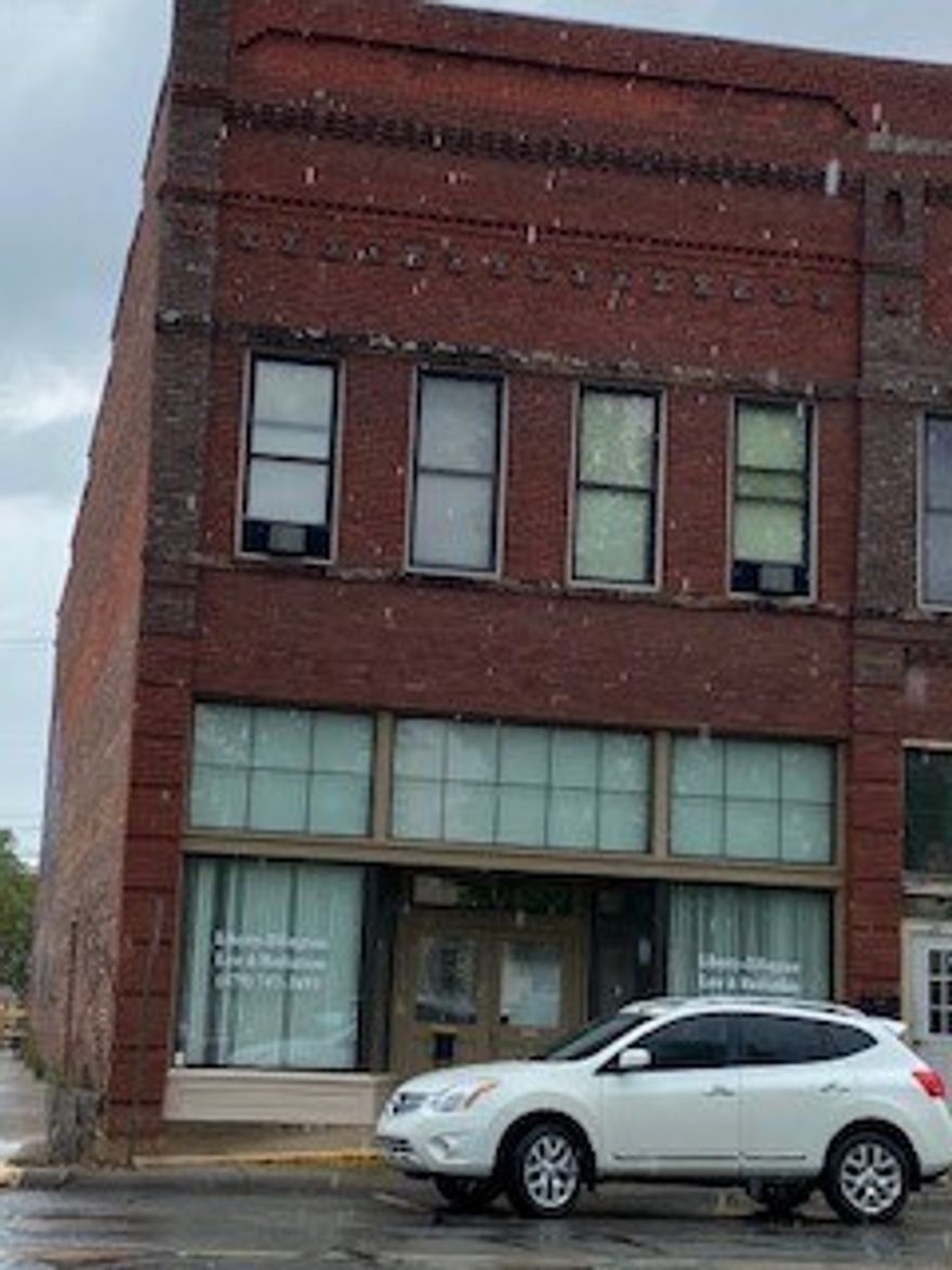 Two story building; Two units; Downstairs 118 Fulton - Current use as law office; Large glass front entry/foyer, 4 offices, large break room, two handicap bathrooms, high ceilings, new plank flooring.
Upstairs Apartment 122 Fulton - Current use as residential with long term tenant; Open living/dining/kitchen area, two large bedrooms, 1 bath.