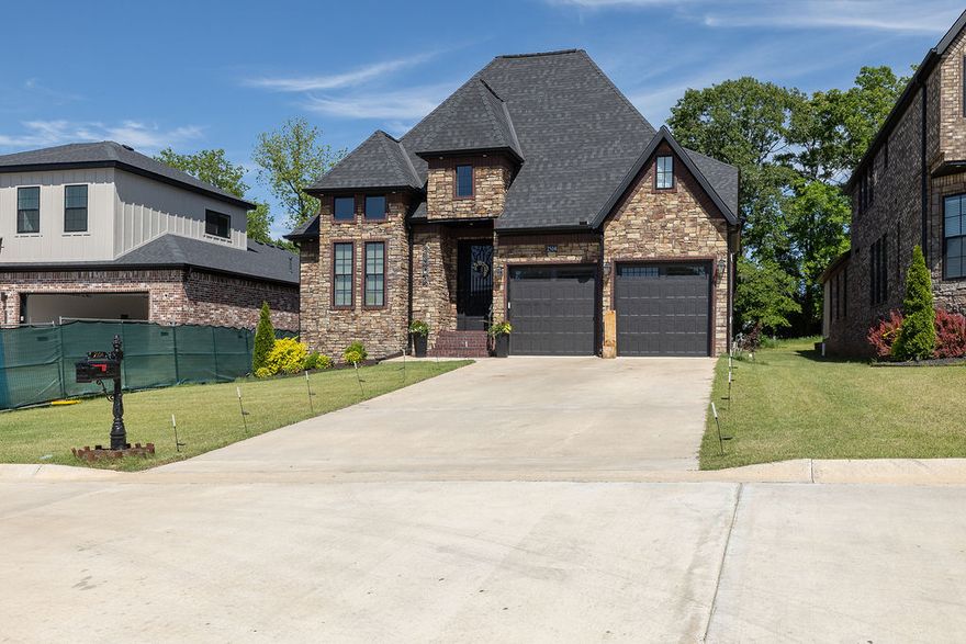 Ideally located on Crossover with quick access to everything Northwest Arkansas has to offer, this 4 bed, 3 full and 2 half bath home blends space, function, and thoughtful design. The main level features open, connected living with luxury-style tile throughout the shared spaces, cased windows, and a large kitchen offering abundant cabinetry and countertop space.

Designed for flexibility, the layout includes both the primary suite and a guest en-suite on the main level, along with a formal dining room and dedicated office. Upstairs, you’ll find two additional bedrooms, a spacious bonus room, and a second living area perfect for media, play, or additional entertaining space.

The generous primary suite offers a spacious bath and oversized closet, while practical conveniences include two laundry areas—one upstairs and one located in the primary suite. Outside, enjoy a covered back porch overlooking the backyard, plus a two-car garage completing this well-appointed home in a highly accessible location.